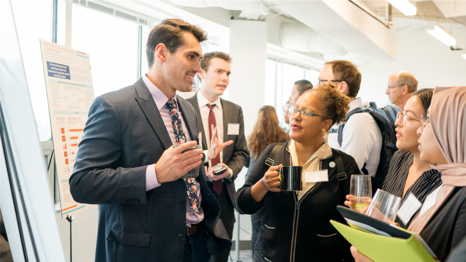 People talking during poster presentations