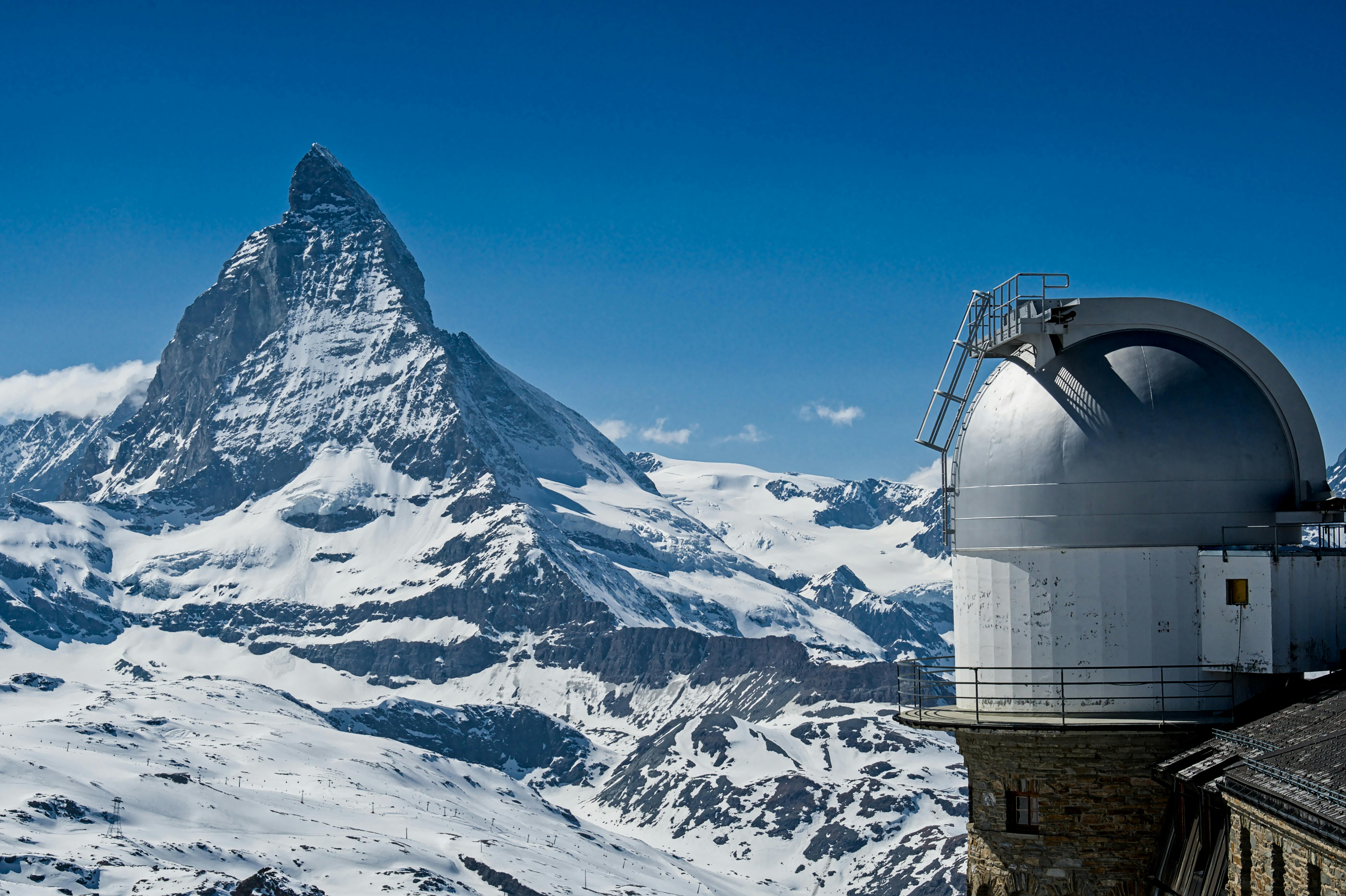observatory in snowy mountain landscape