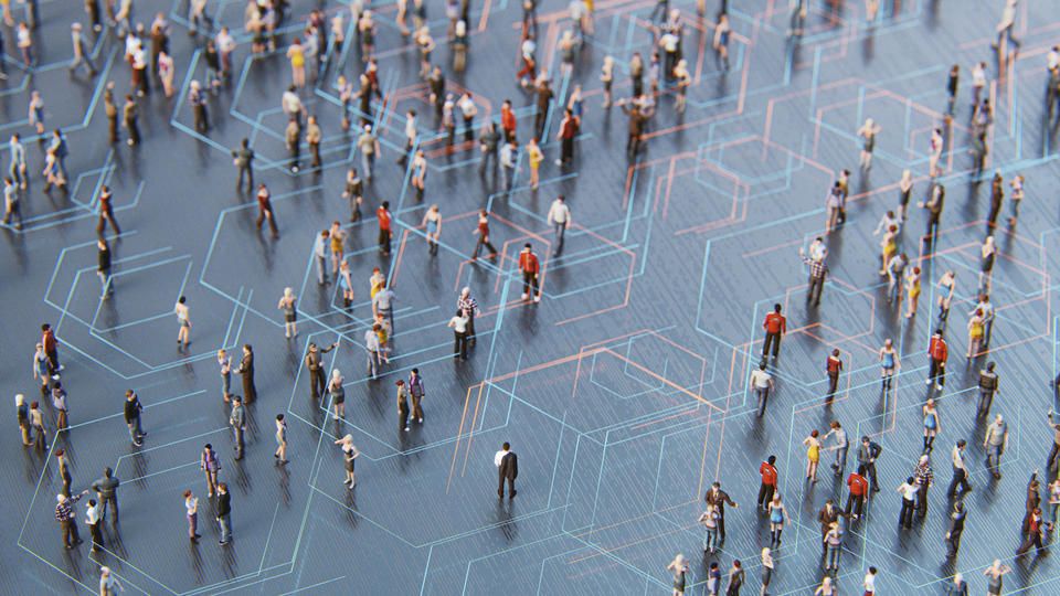 overhead view of large group of people walking around and interacting