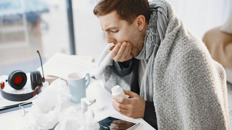 Man coughing into his hand