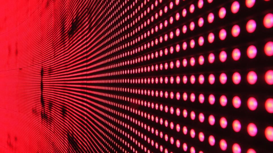 Red dots in a grid coming towards you