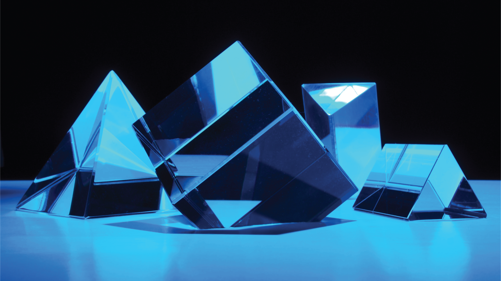 Mirrored glass shapes with blue light on them