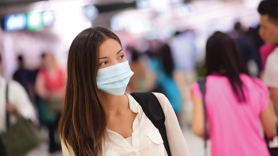 Person wearing flu mask