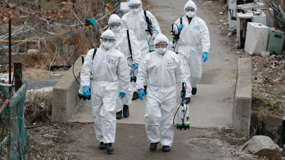 South Korean soldiers wearing protective gear walk to spray disinfectant as a precaution against the new coronavirus in Seoul, South Korea, Tuesday, March 3, 2020. China's coronavirus caseload continued to wane Tuesday even as the epidemic took a firmer hold beyond Asia.