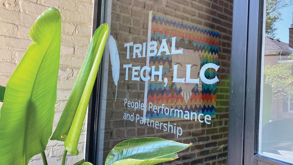 Glass window with the words Tribal Tech, LLC