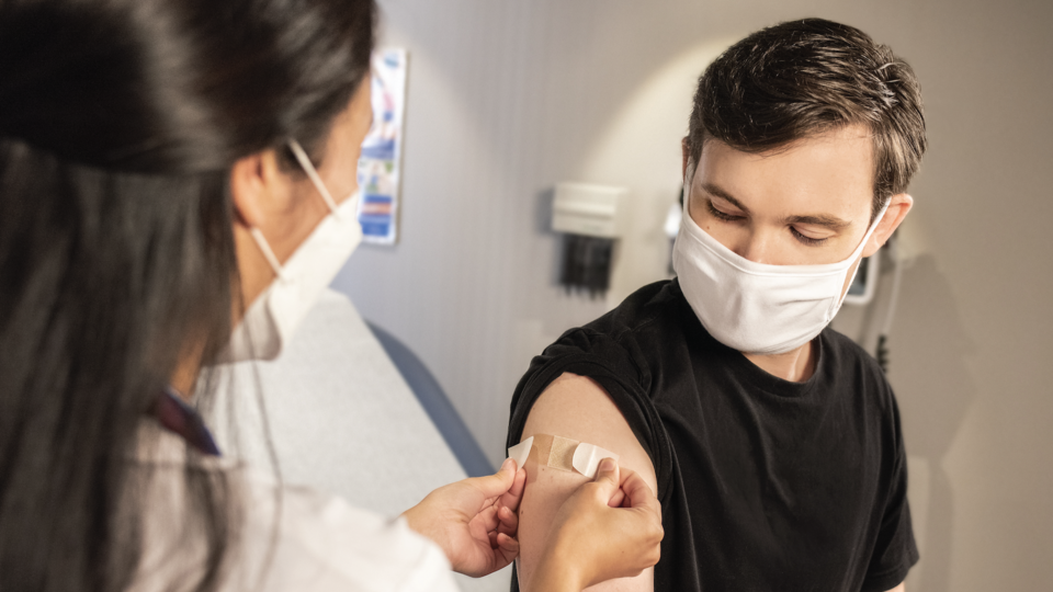 Young man receiving vaccine